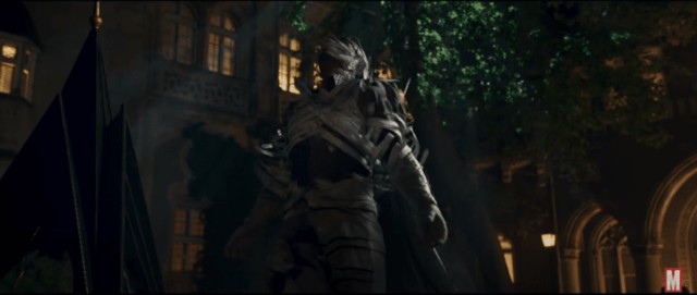 A mysterious armored figure standing in a dark, atmospheric courtyard at night.