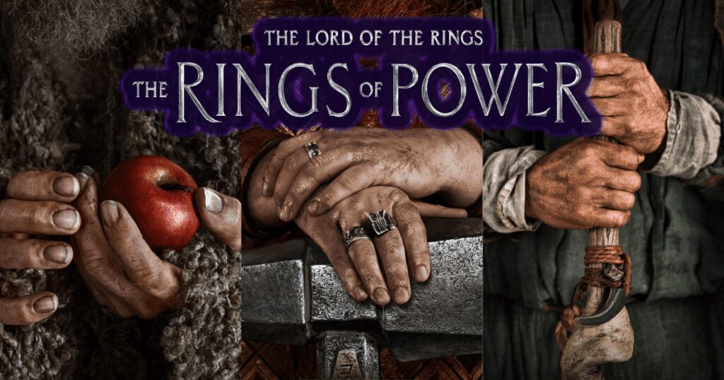 Hands holding an apple and rings from "The Lord of the Rings: The Rings of Power".