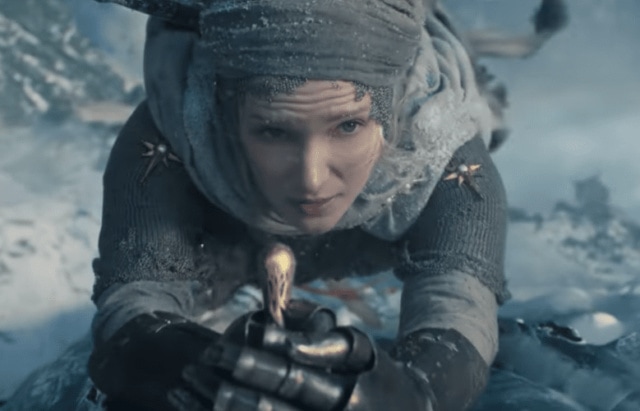 Galadriel (Morfydd Clark) climbing a frozen 