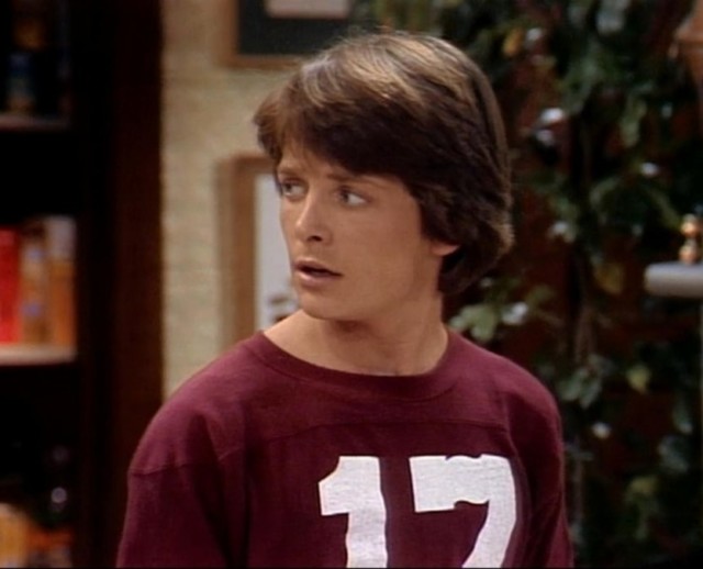 Michael J. Fox as Alex P. Keaton in Family Ties