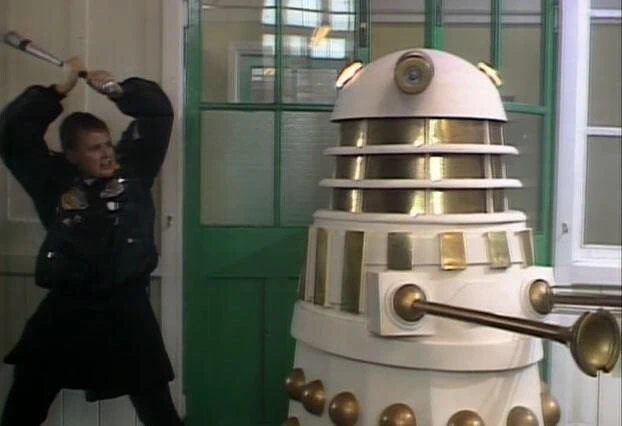 Ace destroys a Dalek with a baseball bat in Remembrance of the Daleks