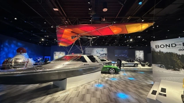 Moonraker Hang glider and Glastron Boat in the center of the Bond In Motion exhibit