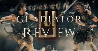 gladiator-2-review-banner warriors fighting in background Paul Mescal and Pedro Pascal