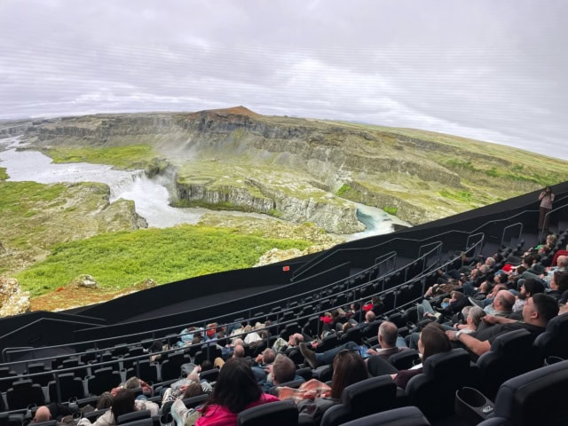 crowd in seats watching a nature scene at Fort worth's omni-theater