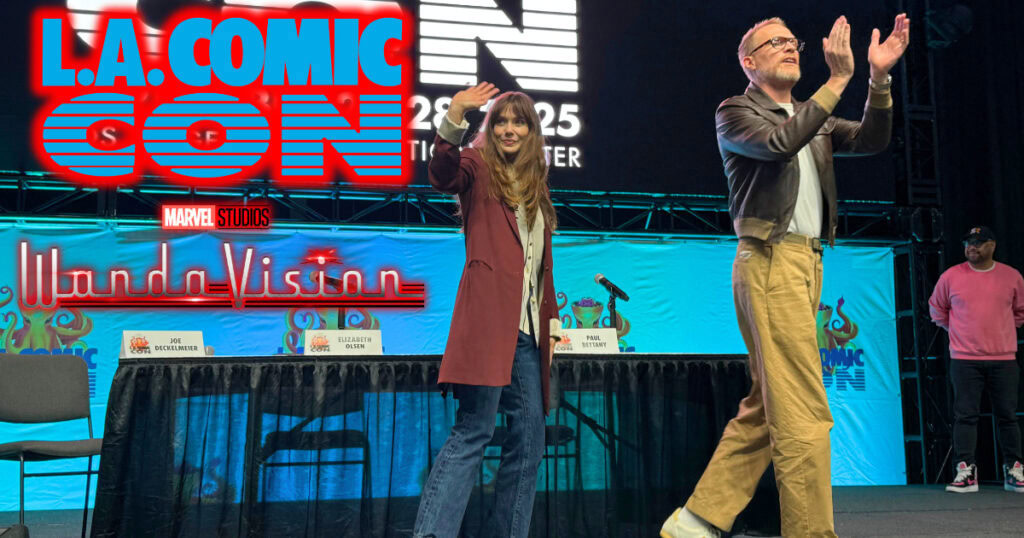 WandaVision panel recap banner, Elizabeth Olsen and Paul Bettany walking offstage with text "L.A. Comic Con" logo and "WandaVision" logo glowing red to the left of them