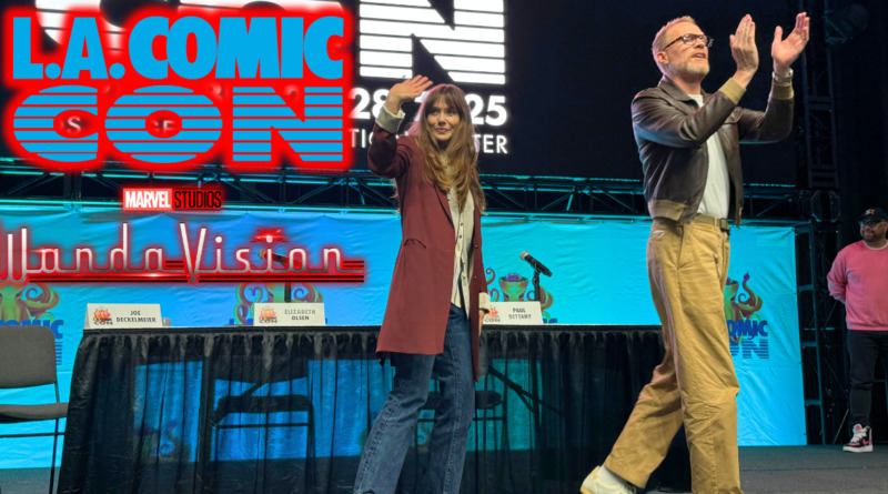 WandaVision panel recap banner, Elizabeth Olsen and Paul Bettany walking offstage with text "L.A. Comic Con" logo and "WandaVision" logo glowing red to the left of them