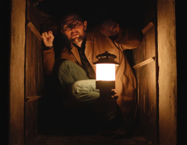 Adam Scott in a scene in the movie Hokum