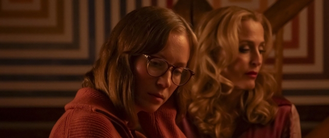 Two women with glasses and blonde hair in a dimly lit room. Still from the film Teenage Sex and Death at Camp Miasma at Fantasia Fest 2026
