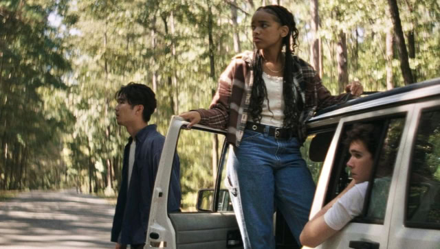 an image from the film It Ends a group of 3 teenagers traveling together