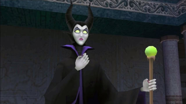 Disney's Maleficent character with horns and staff in a dark setting.