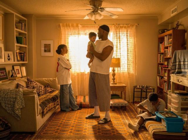 Family spending quality time together in a cozy living room. The cast of the film Your Mother Your Mother Your Mother starring Mahershala Ali