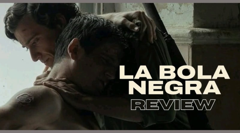 La Bola Negra movie review still with two men embracing in dim light.